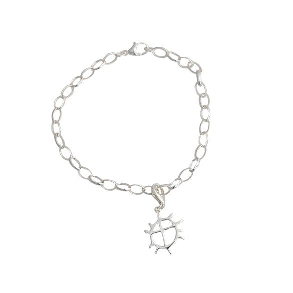 Berlock med det samiska solhjulet. Silverarmband